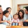 A happy family sitting together in a cozy living room, symbolizing harmony and conflict resolution strategies.